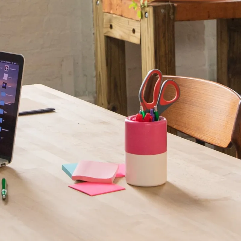 laptop on desk with sticky notes and coffee